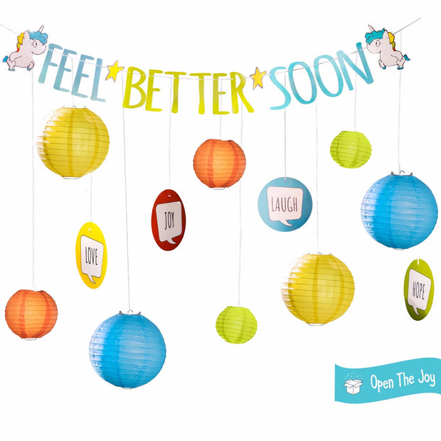 Open the Joy Feel better soon room decoration kit with blue orange green and yellow paper lanterns in three sizes, joy, love, hope and laugh posters to hang, and a get well soon banner with unicorns on it 
